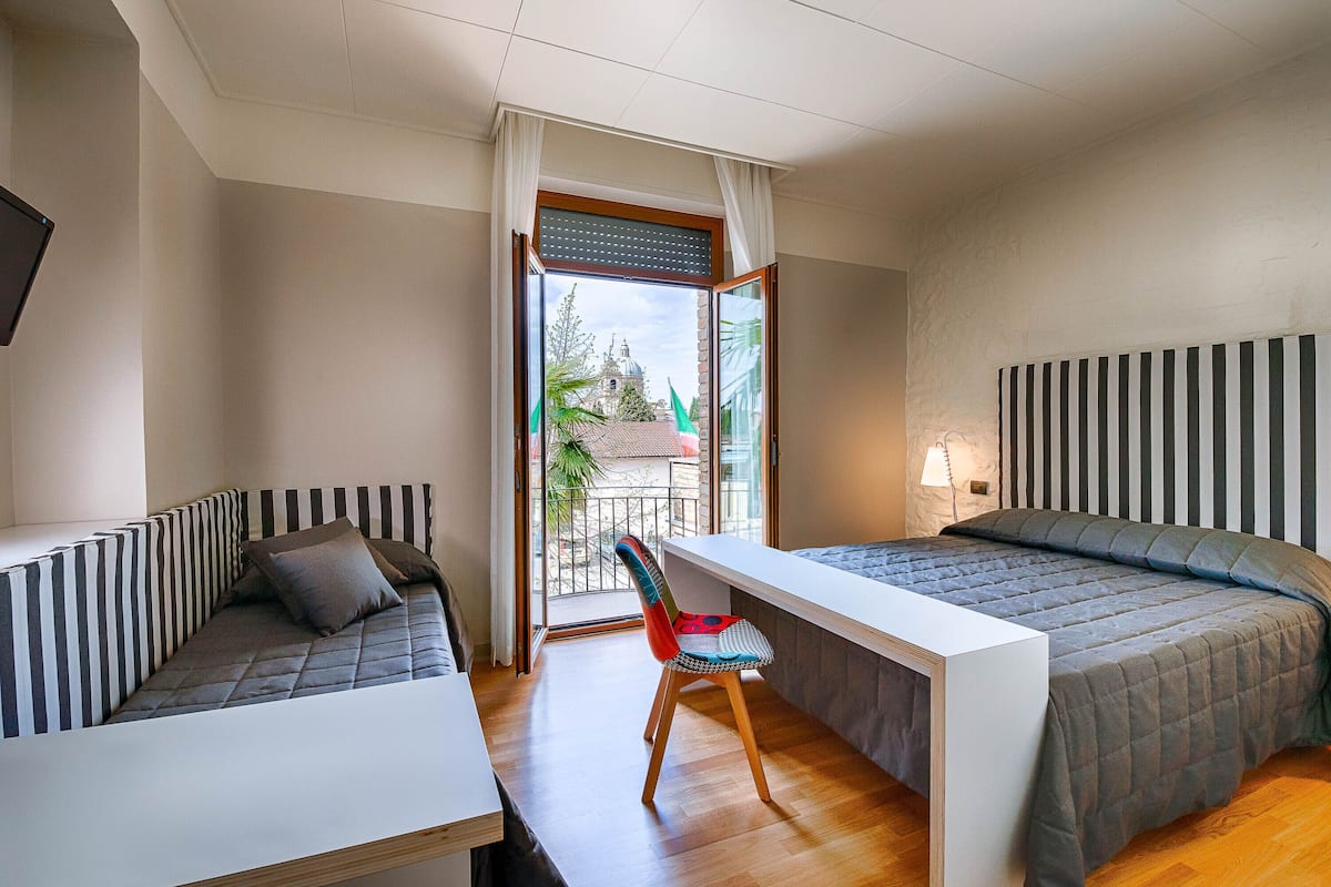 superior triple room | frette italian sheets, down duvets, select comfort beds, desk