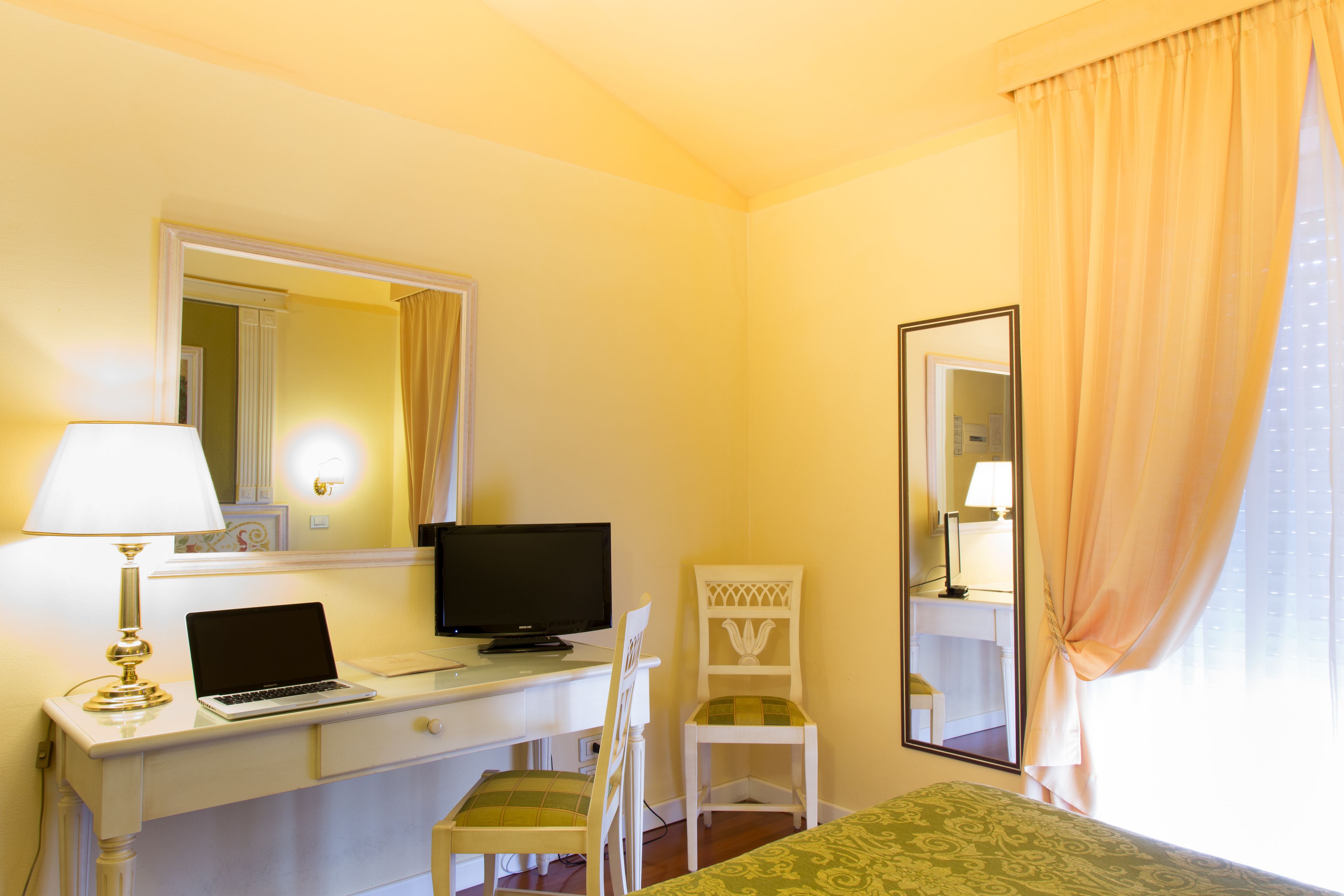 economy double room | minibar, desk, laptop workspace, blackout curtains