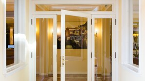 A hotel entrance with a glass door and a sign that reads "TVDER Hotel". - Tuder (Todi)