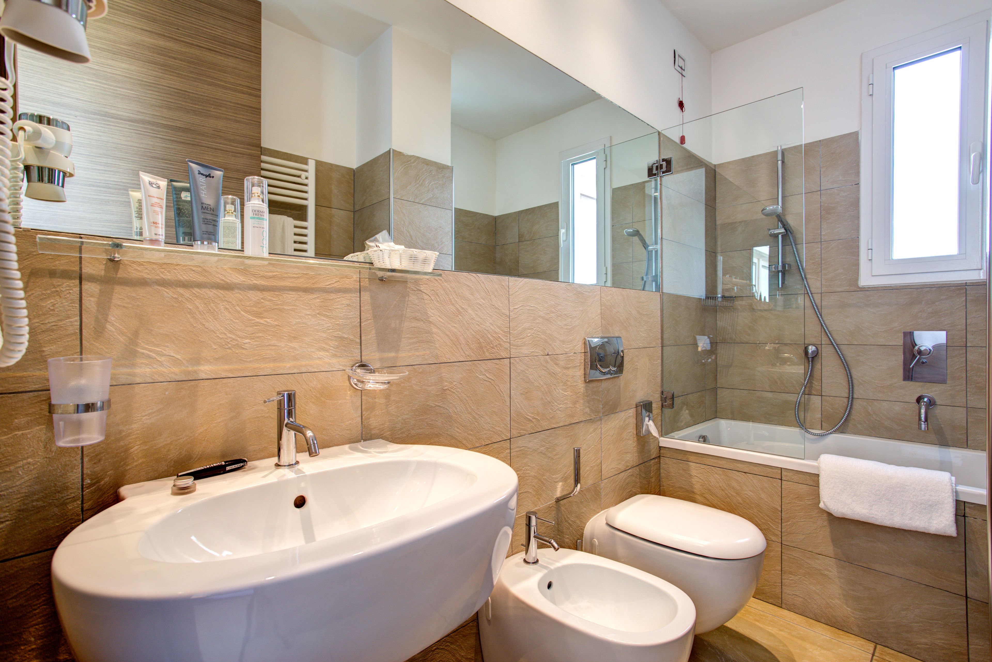 family suite | bathroom | shower, hair dryer, bidet, towels