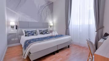 Classic Double or Twin Room | Minibar, in-room safe, desk, iron/ironing board