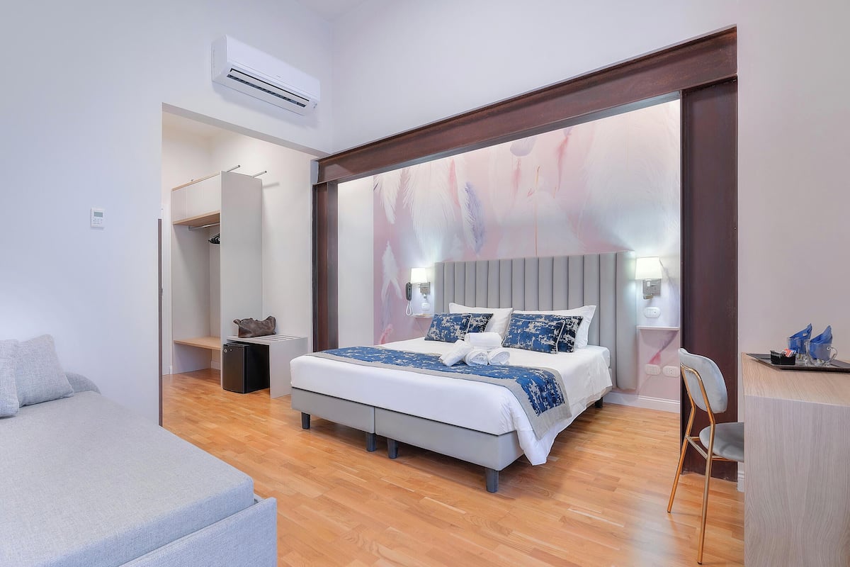 Classic Quadruple Room | Down comforters, minibar, in-room safe, desk
