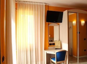 Premium bedding, down comforters, in-room safe, desk
