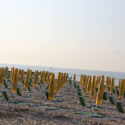 On the beach, sun-loungers, beach umbrellas