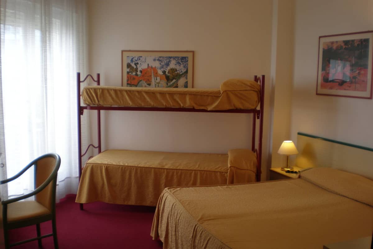 Quadruple Room, Partial Sea View | Minibar, in-room safe, desk, soundproofing