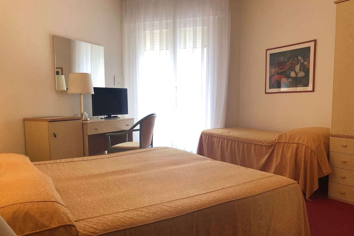 Triple Room, Partial Sea View | Minibar, in-room safe, desk, soundproofing