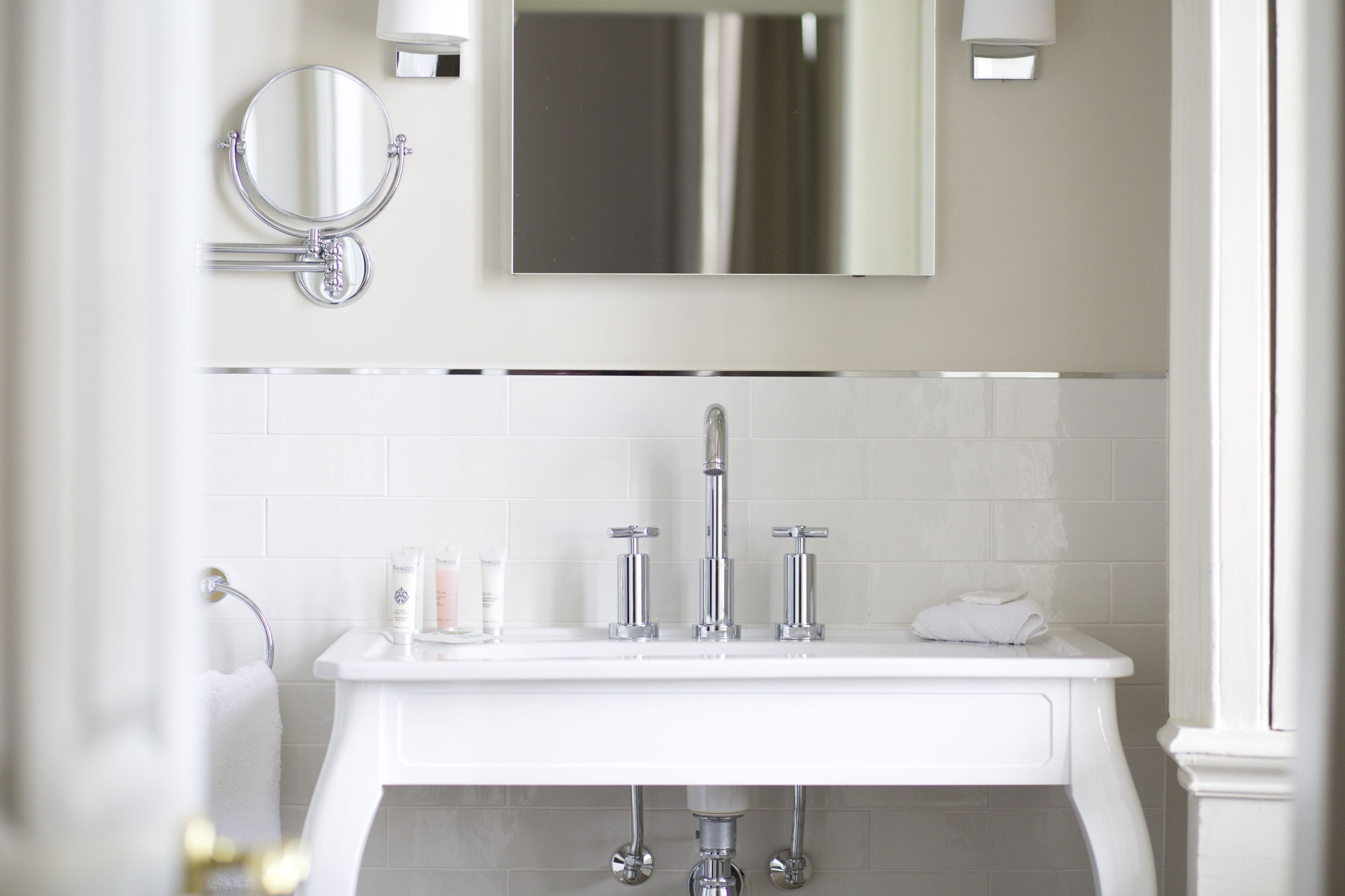 designer toiletries, hair dryer, towels