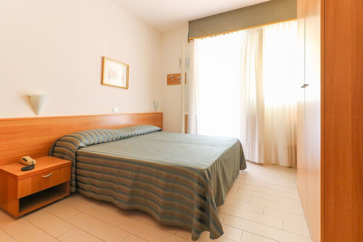 Double Room, Balcony, Pool View | In-room safe, desk, WiFi (free), bed sheets