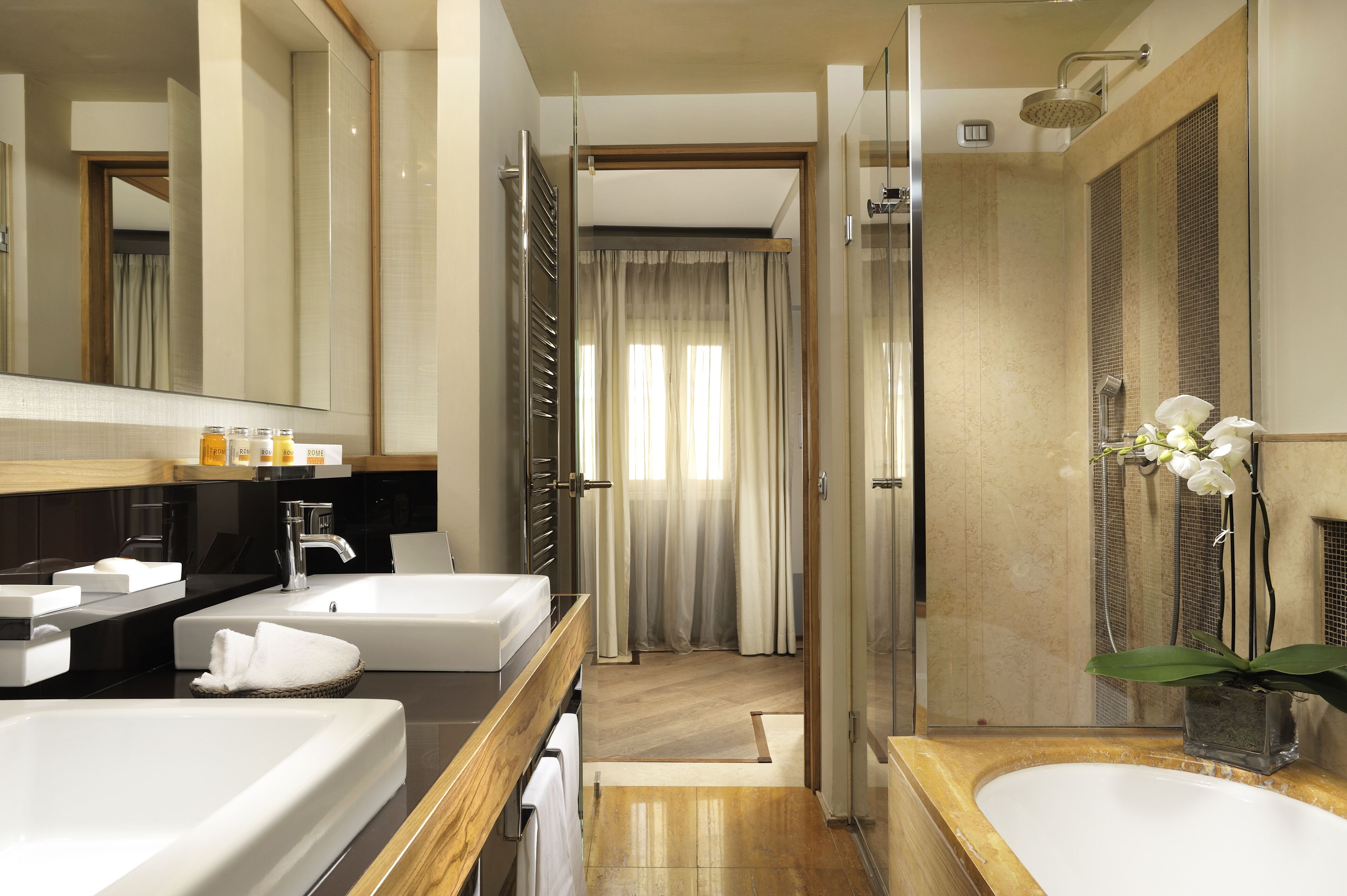 junior suite | bathroom | shower, hair dryer, bathrobes, slippers
