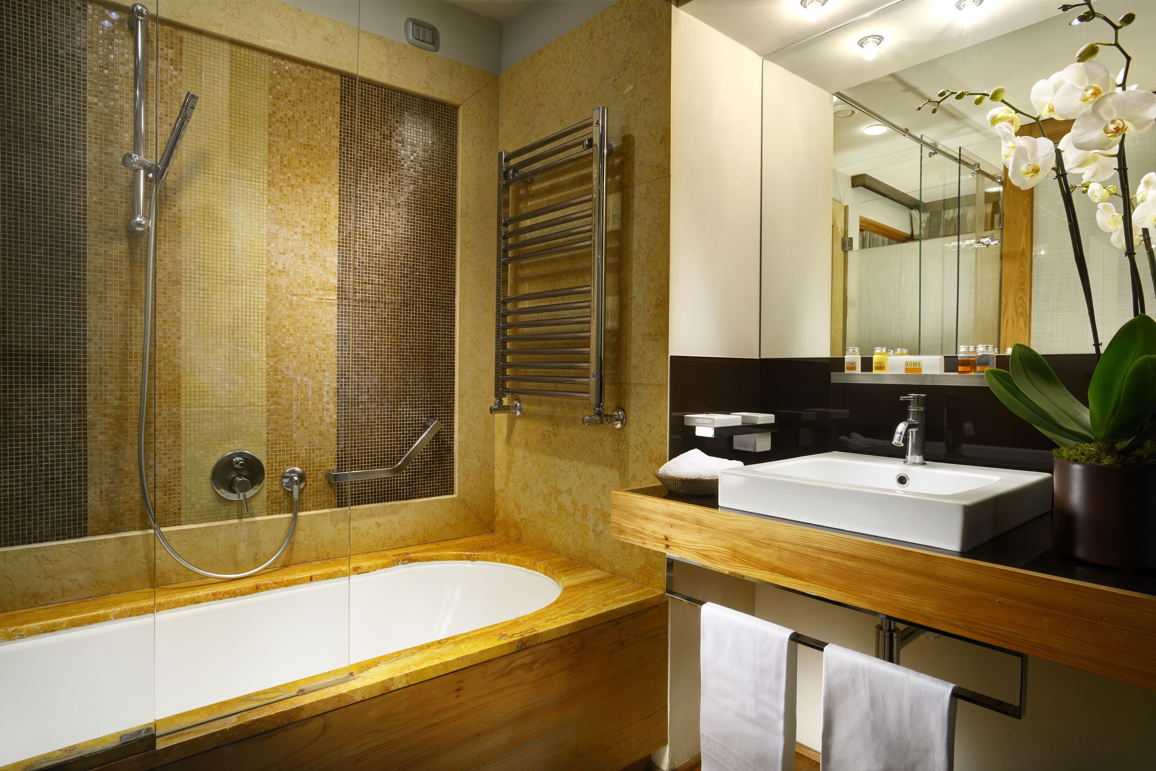 junior suite | bathroom | shower, hair dryer, bathrobes, slippers