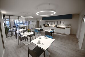 Enjoy meals in a spacious dining area with a comfortable seating arrangement.
