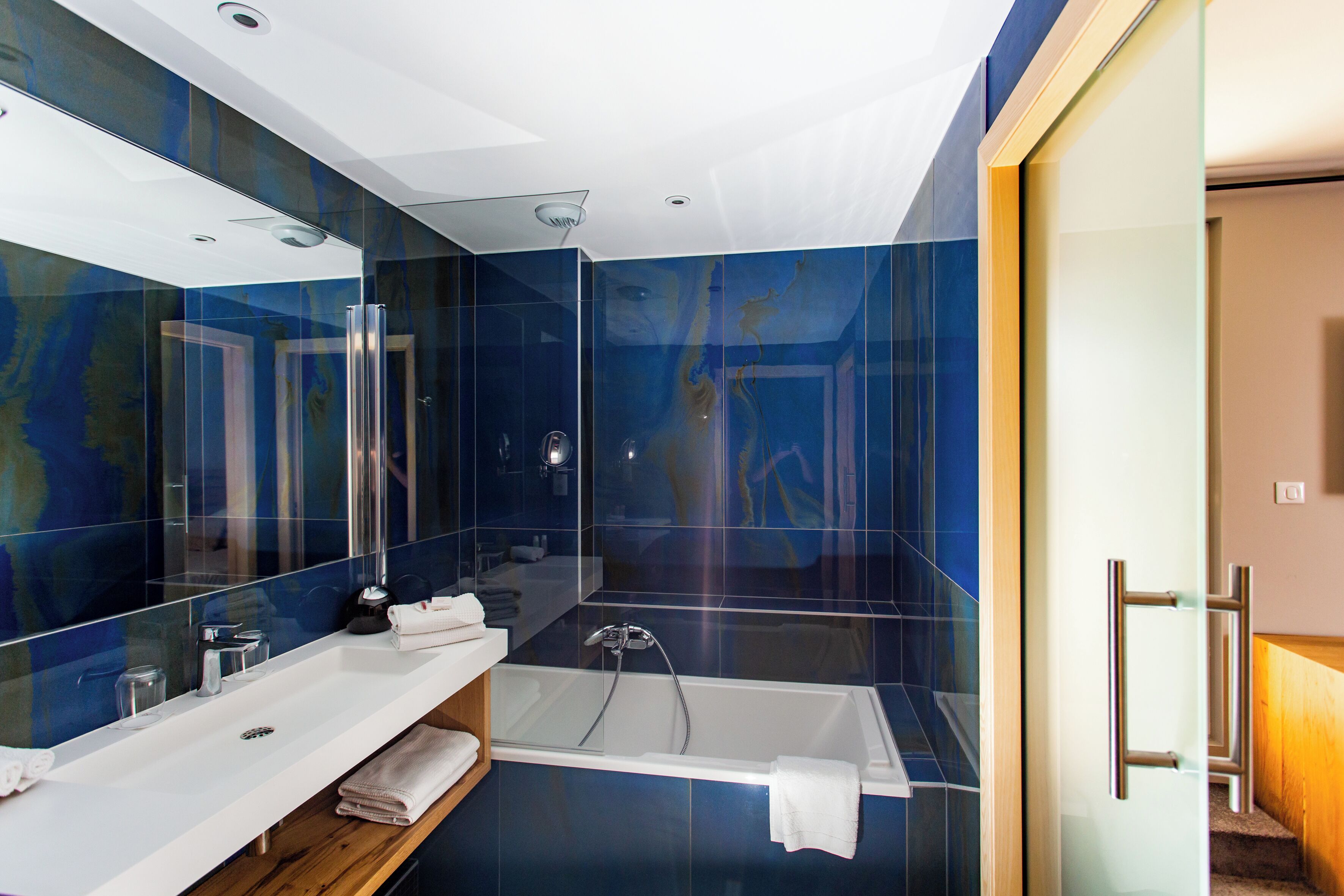 deluxe room | bathroom | designer toiletries, hair dryer, bathrobes, slippers