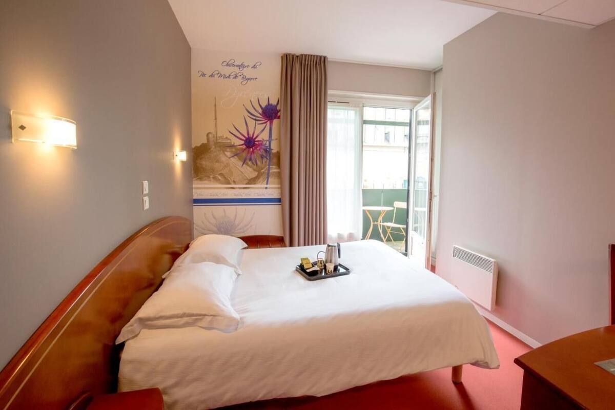 Premium bedding, desk, laptop workspace, blackout drapes