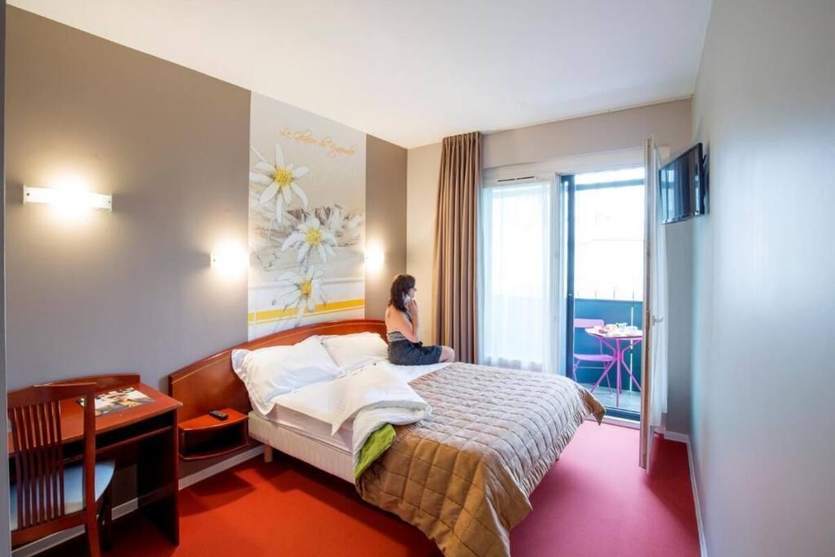 Premium bedding, desk, laptop workspace, blackout drapes