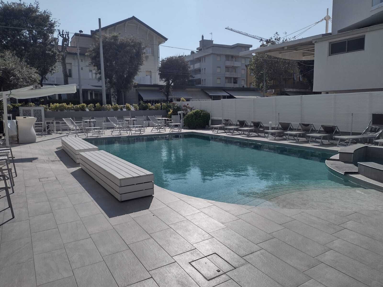 seasonal outdoor pool, pool umbrellas, pool loungers