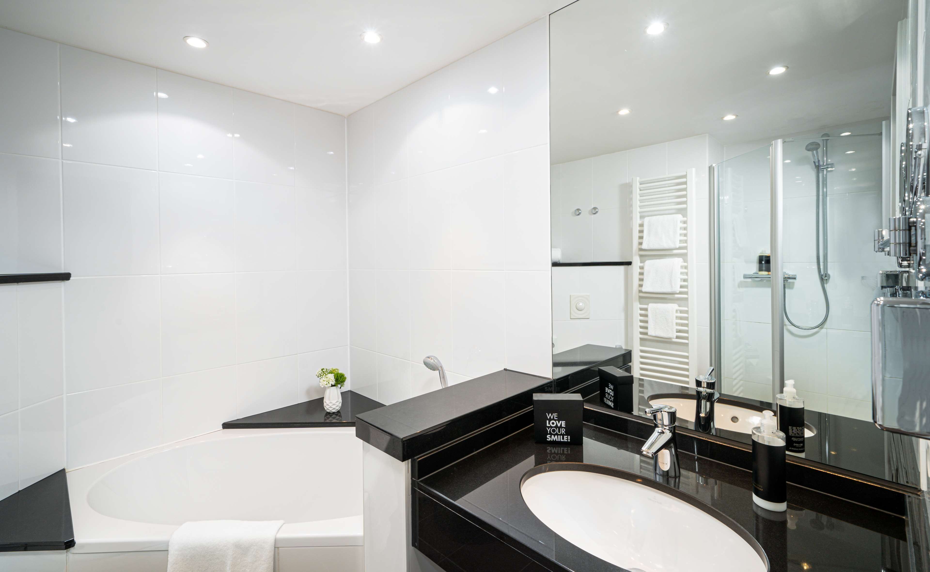 junior suite | bathroom | shower, rainfall showerhead, free toiletries, hair dryer