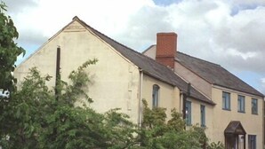 A two-story building with a gabled roof and a chimney. - Brownhill House (Shrewsbury)