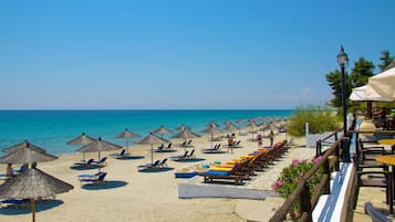 On the beach, sun loungers, beach umbrellas