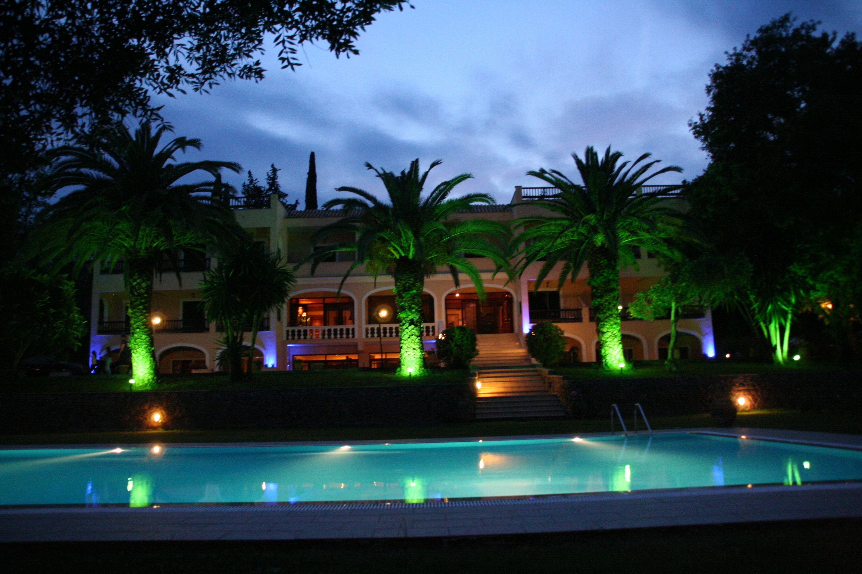 Outdoor pool, open 8:00 AM to 8:00 PM, pool umbrellas