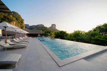 Indoor pool, outdoor pool, open 7:00 AM to 7:00 PM, sun loungers