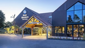 A modern hotel with a prominent 'Best Western' sign, large windows, and a covered entrance area. - Best Western Amarys Hotel & Spa (Rambouillet)
