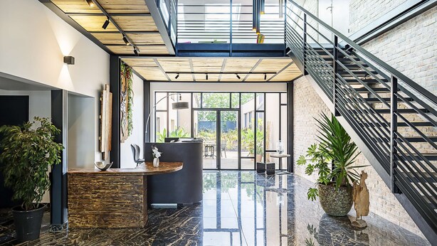 A modern lobby with a reception desk, a staircase, and a glass ceiling. - Best Western Amarys Hotel & Spa (Rambouillet)