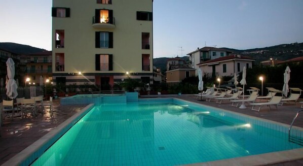 2 outdoor pools, open 9:00 AM to 7:00 PM, pool umbrellas, pool loungers
