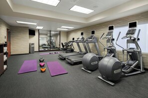 A gym with treadmills, elliptical machines, and exercise balls. - Courtyard by Marriott Flagstaff (Flagstaff)