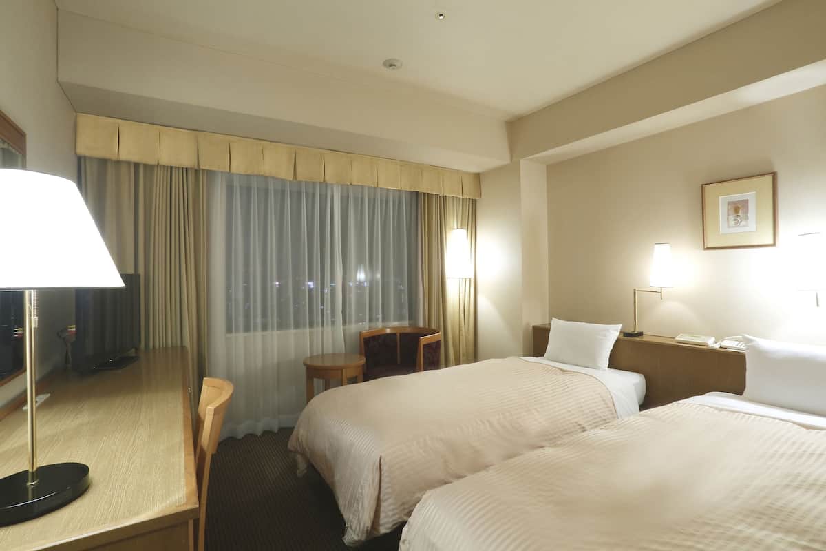 Premium bedding, pillow-top beds, desk, blackout curtains