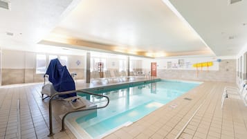 Indoor pool, open 10:00 AM to 10:00 PM, pool loungers