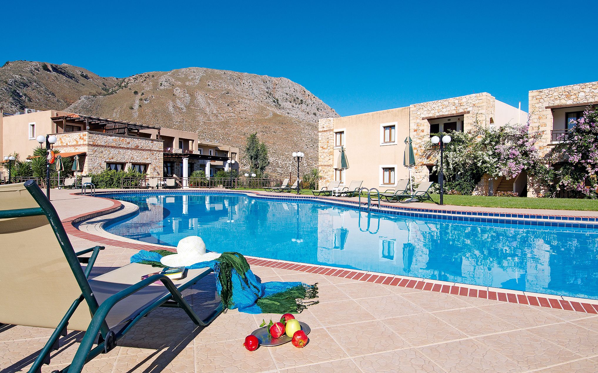 Outdoor pool, open 10:00 AM to 6:00 PM, pool umbrellas, sun loungers