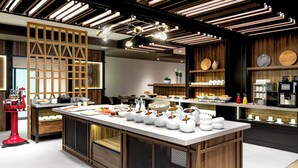 A modern kitchen with a central island, wooden accents, and a variety of kitchenware. - AC Hotel by Marriott Bratislava Old Town (Bratislava)