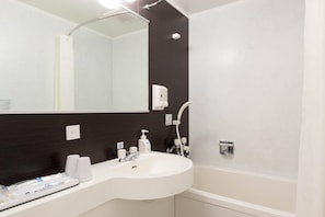 Combined shower/bathtub, hair dryer, bathrobes, slippers