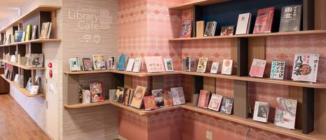 A library cafe with bookshelves and a counter.