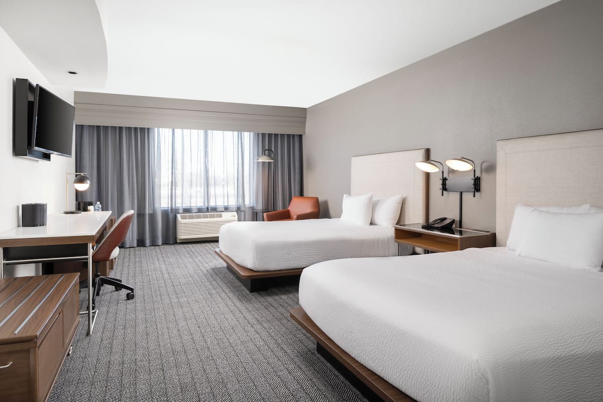 Premium bedding, desk, laptop workspace, iron/ironing board