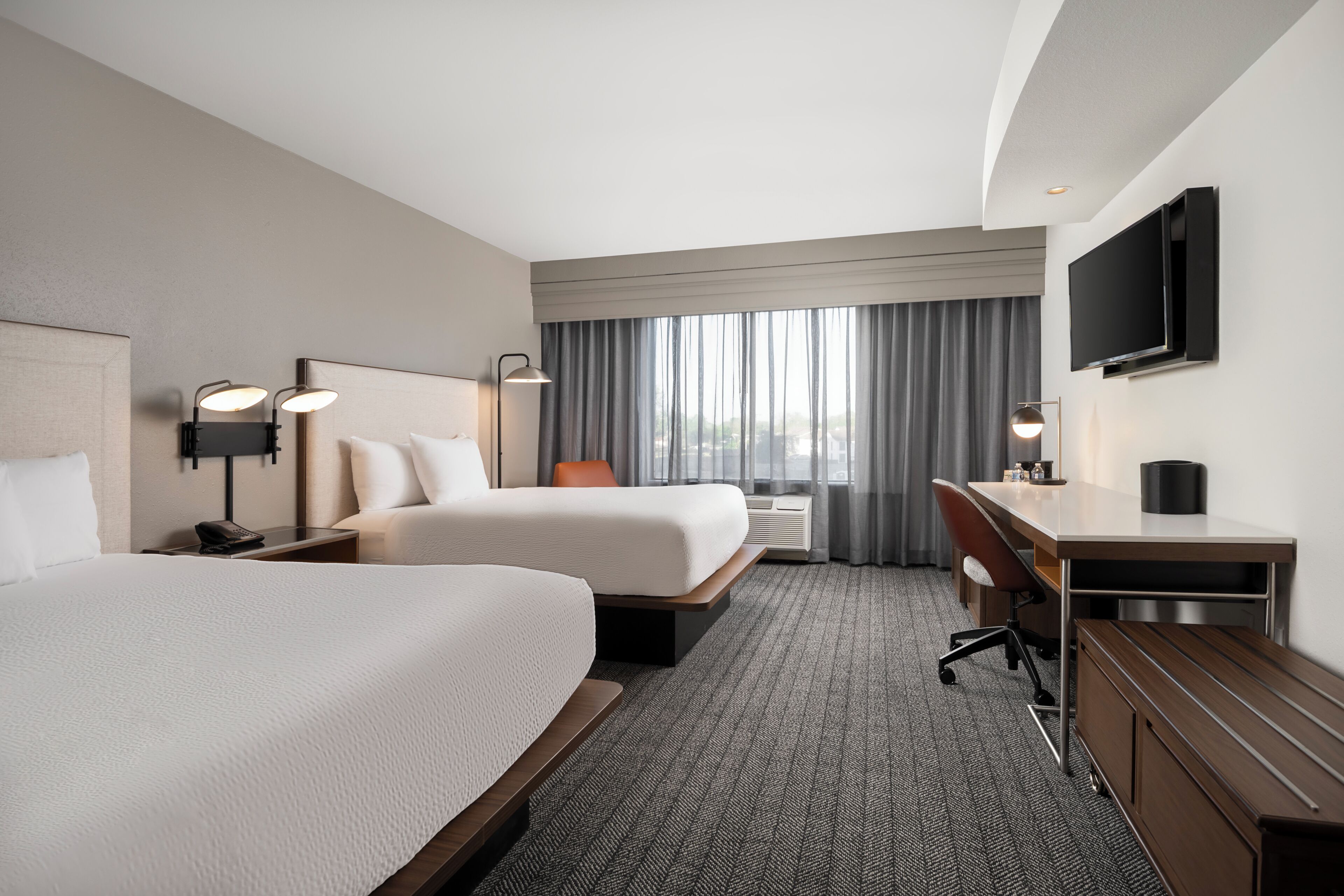 Premium bedding, desk, laptop workspace, iron/ironing board