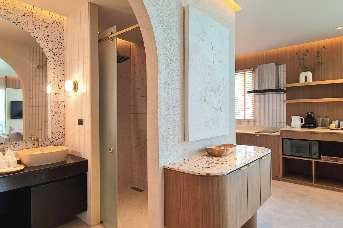 honeymoon ocean front pool suite | bathroom | free toiletries, hair dryer, bathrobes, slippers