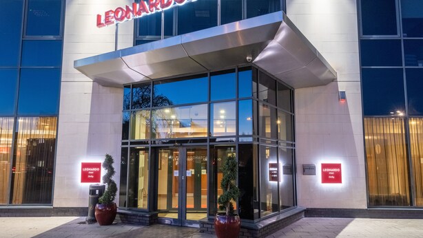 The exterior of the Leonardo Hotel with a modern facade, large glass entrance, and illuminated signage. - Leonardo Hotel Derby (Derby)