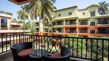 Pool View Deluxe Room | 1 bedroom, in-room safe, laptop workspace, blackout curtains