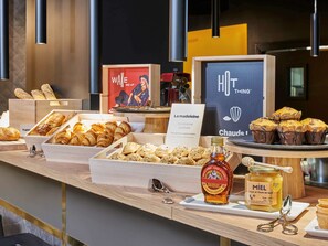 Indulge in a selection of freshly baked pastries, bread, and sweet treats.