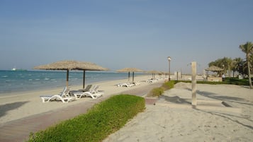 Private beach, white sand, free beach cabanas, sun loungers