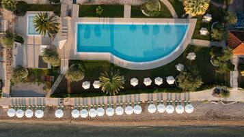 2 outdoor pools, open 10:00 AM to 8:00 PM, pool umbrellas, pool loungers