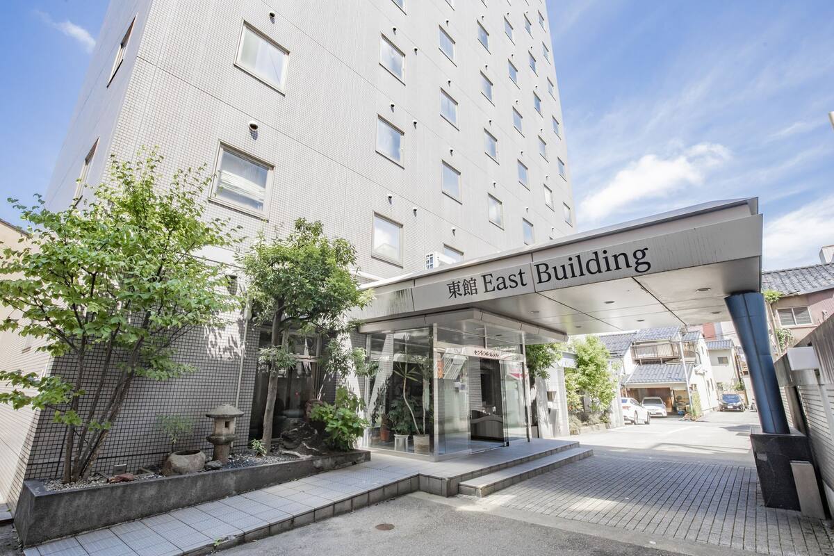 A modern building with a sign reading "East Building".