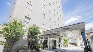 A modern building with a sign reading "East Building".