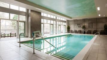 Indoor pool, open 6:00 AM to 10:00 PM, pool loungers