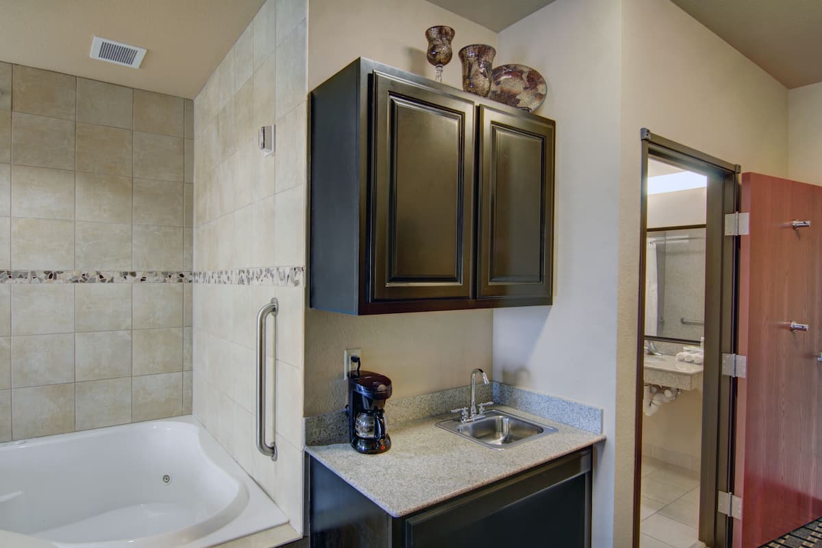 Suite, 1 King Bed | In-room safe, desk, iron/ironing board, free cribs/infant beds