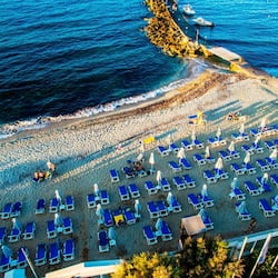 On the beach, sun-loungers, beach umbrellas, beach towels