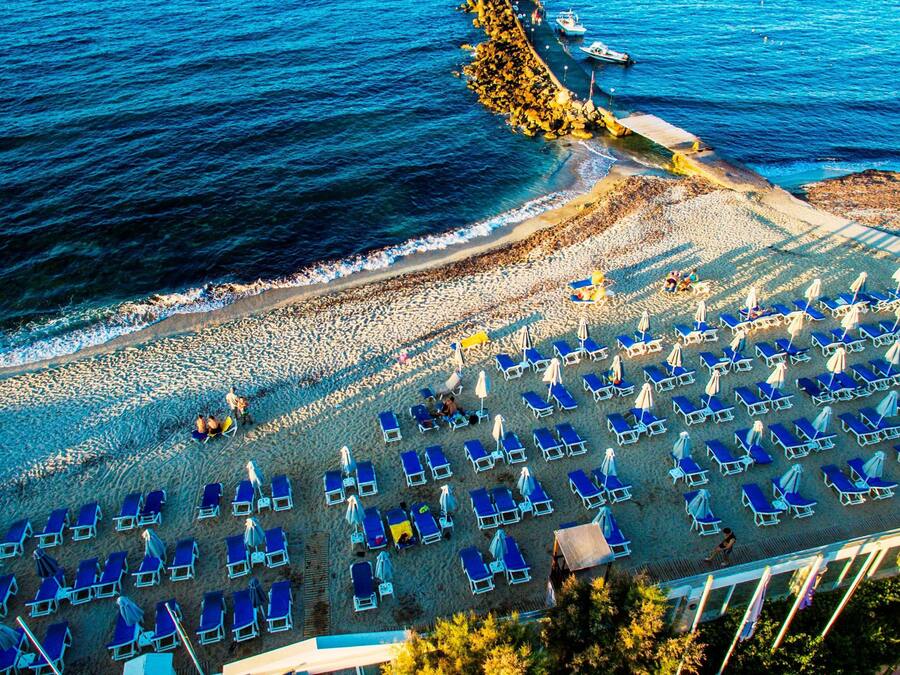On the beach, sun-loungers, beach umbrellas, beach towels