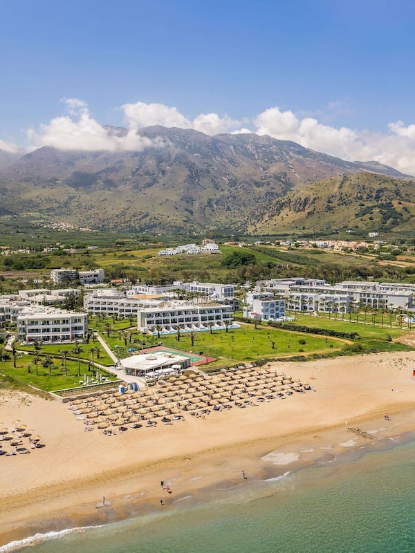 On the beach, sun-loungers, beach towels, beach volleyball