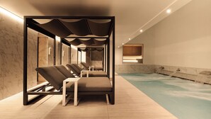 A modern spa area with a pool, lounge chairs, and a wooden wall. - Kimpton Blythswood Hotel & Spa by IHG (Glasgow)